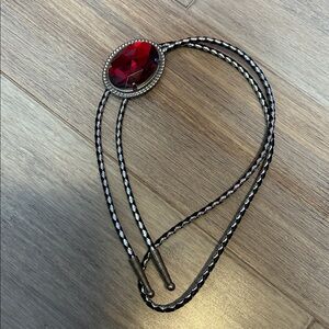 Red Plastic Gemstone Bolo Tie with black gray leather cord and metal tip vtg